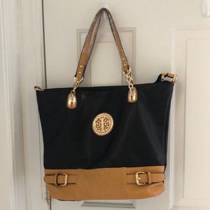 Large Black and Tan leather tote. Brand new.